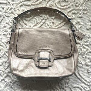 Coach small hand bag. Used, in great condition. Satin finish, champaign color.
